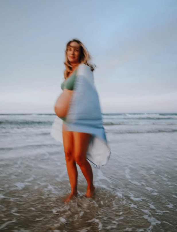 New mother back on the beach after pain relief treatment, Gold Coast
